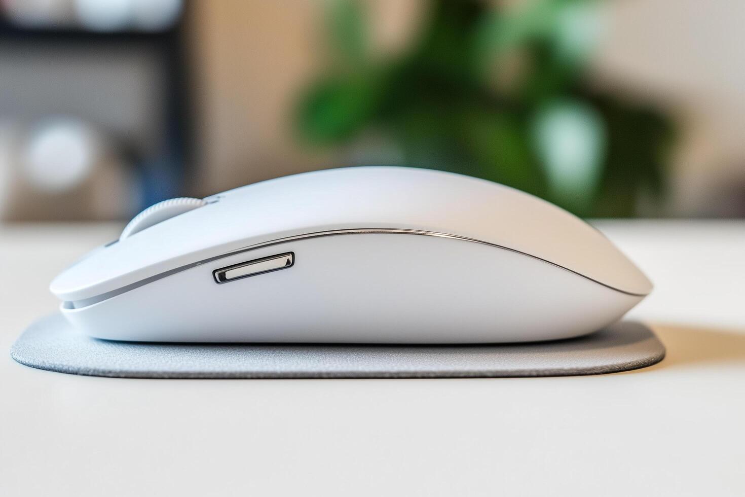 Close-Up of a Modern Computer Mouse Resting on a Sleek Mouse Pad on a Minimal Desk Setup photo