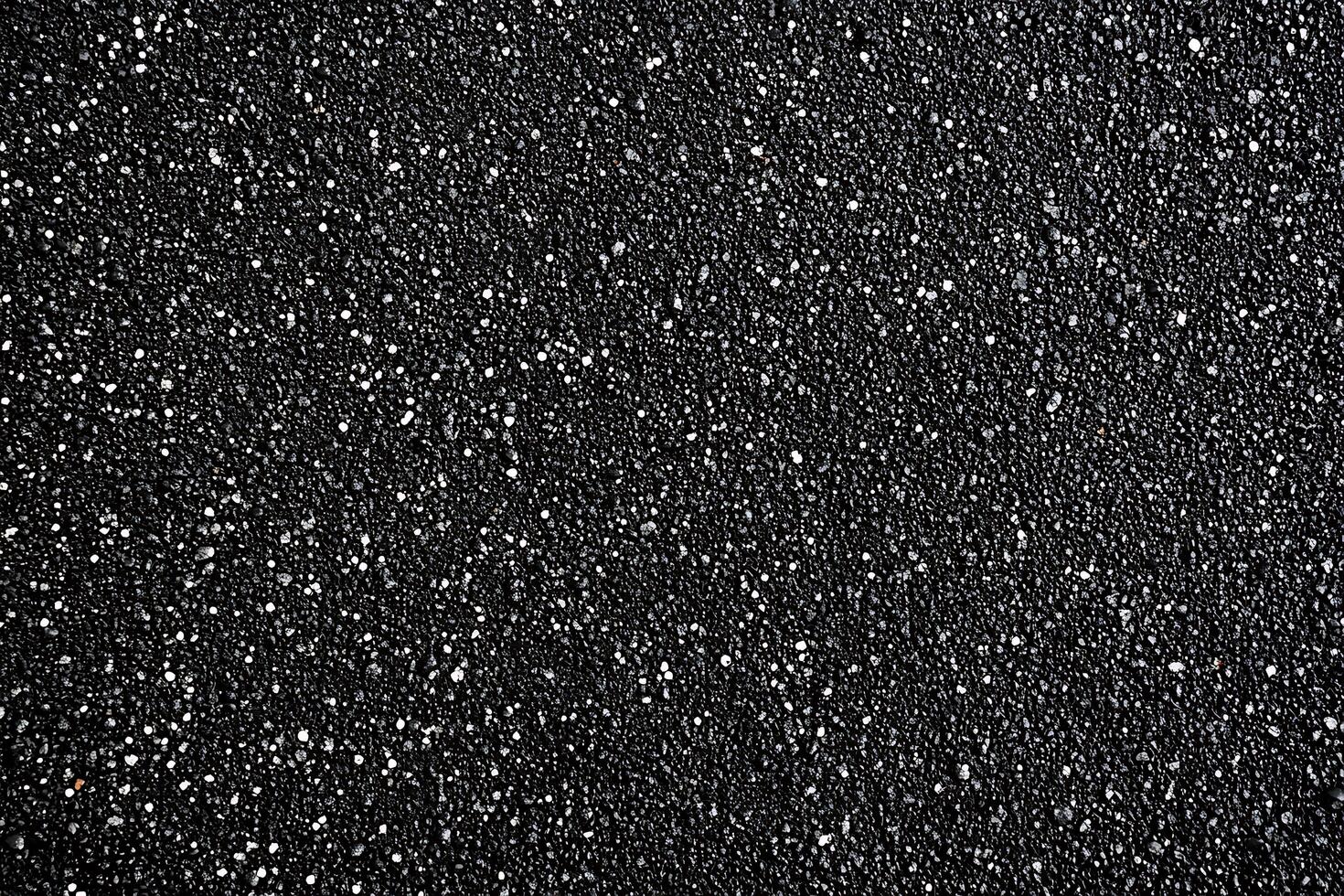 Close-up of Black Sand with White Specks photo