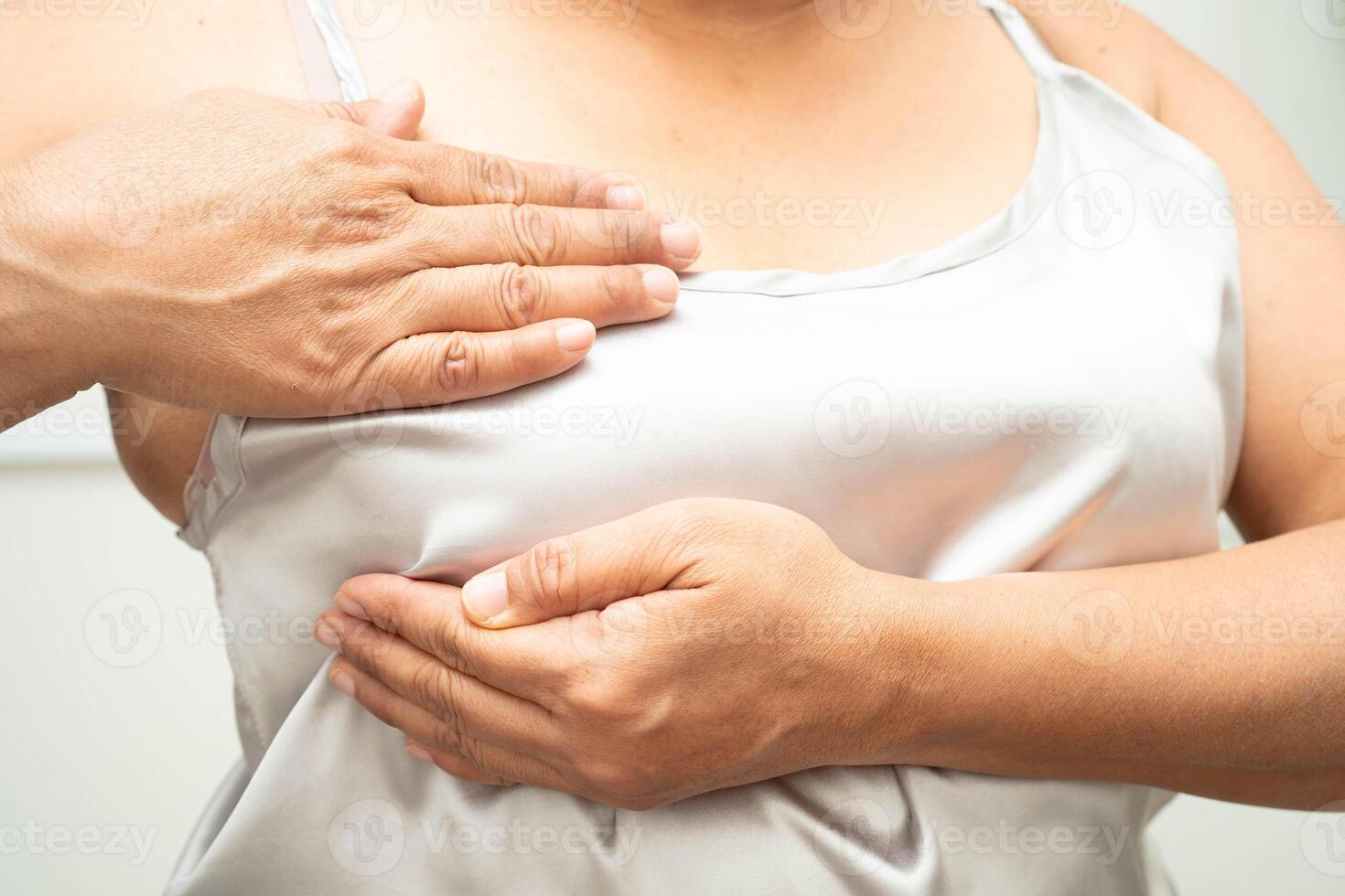 Asian woman self touching check lump or Breast cancer, Breast Self photo