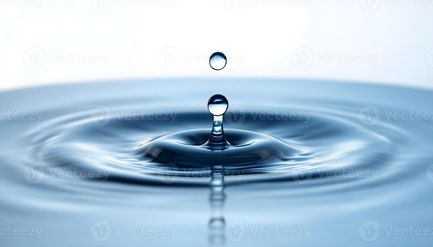 Water droplet with a drop of water falling into it photo