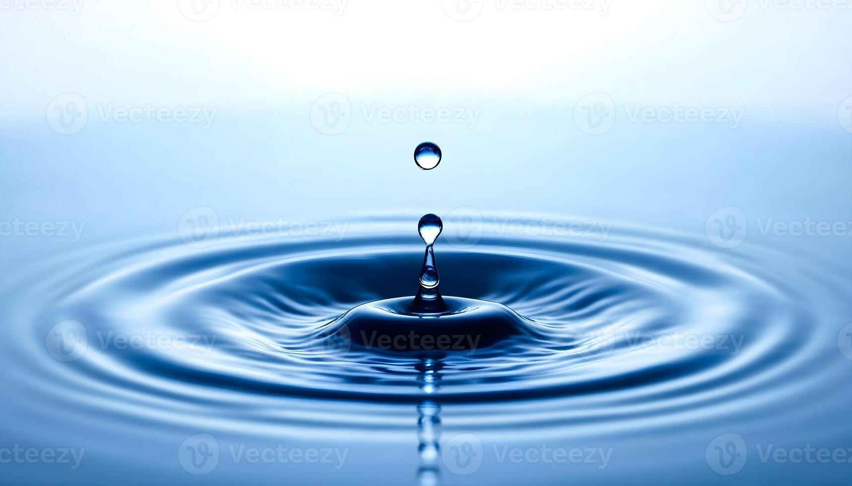 Water drop with ripple effect photo