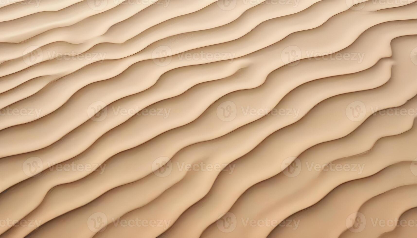 A sand dune with waves in the background photo