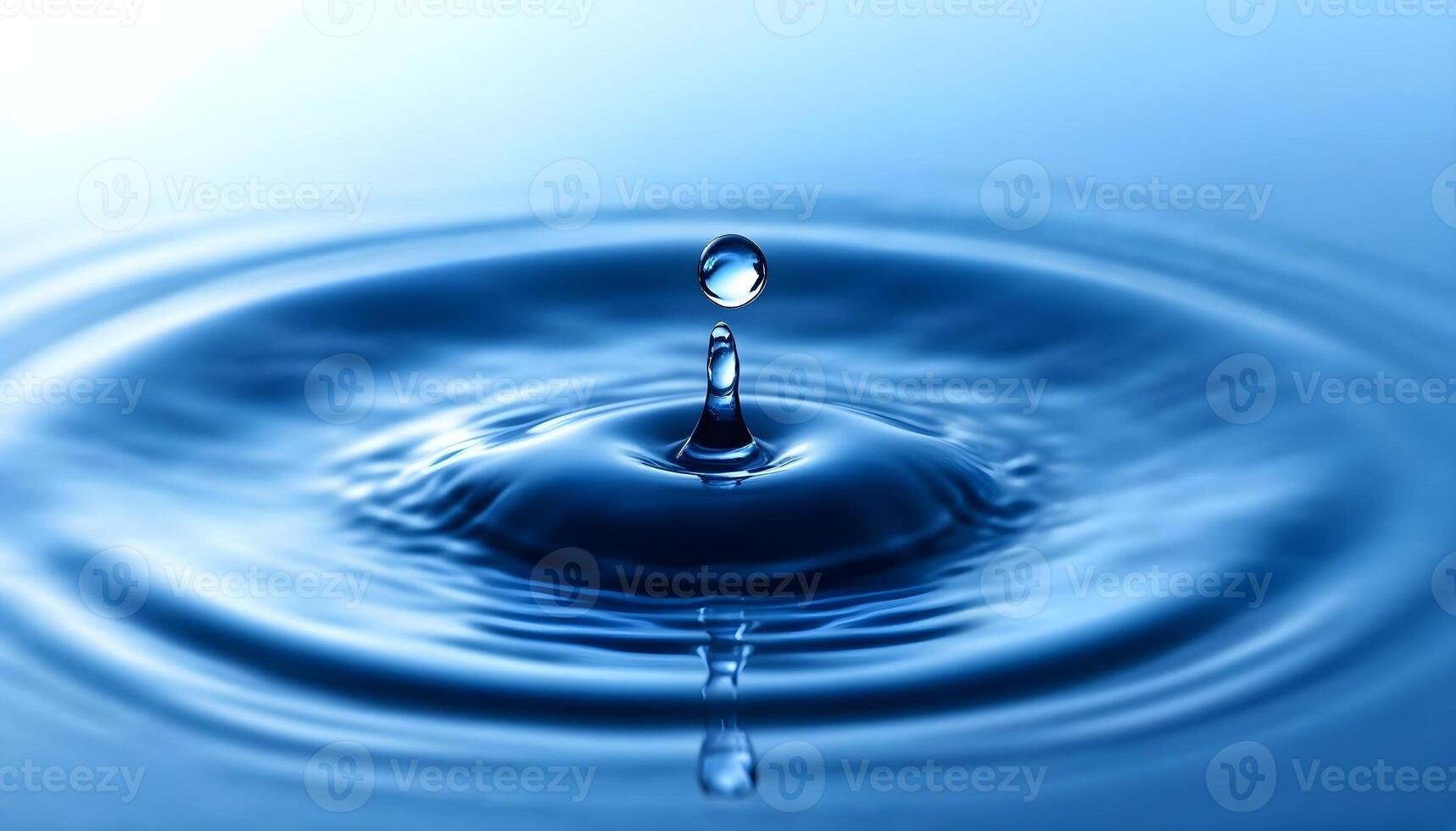Water drop with ripple effect photo