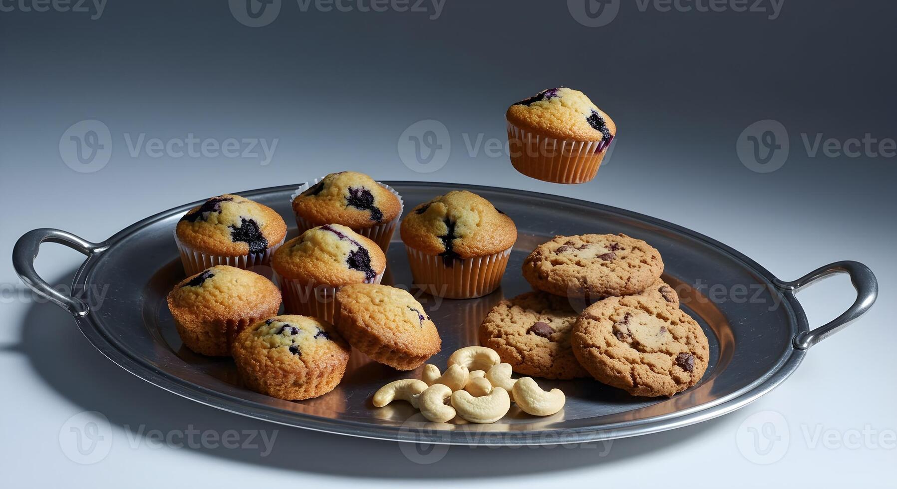 a tray of muffins and other food items on a table photo