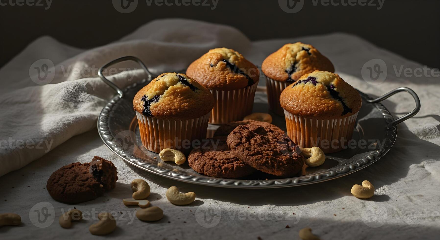 a tray of muffins with cashews and blueberries photo