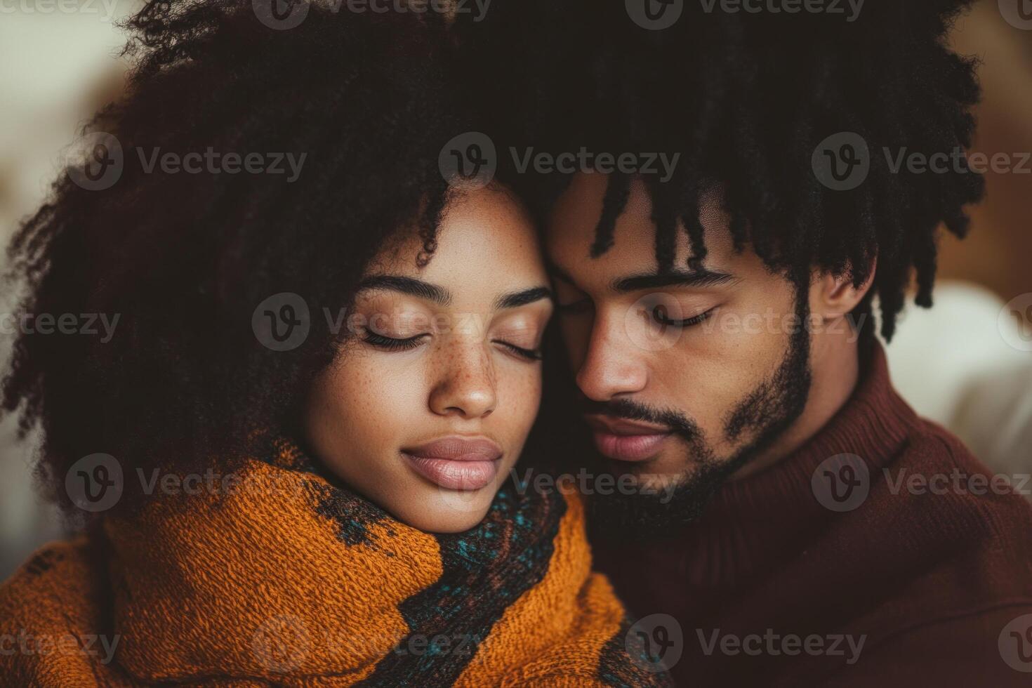 Cozy couple enjoys intimate moment together in warm embrace during a cold day at home photo