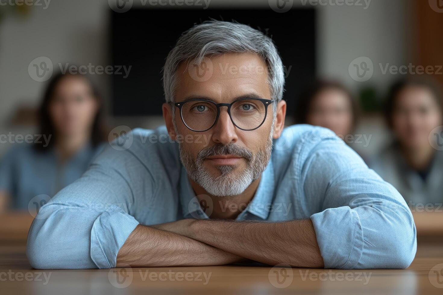 Engaging discussion in a modern office setting with a focused speaker and attentive audience members photo