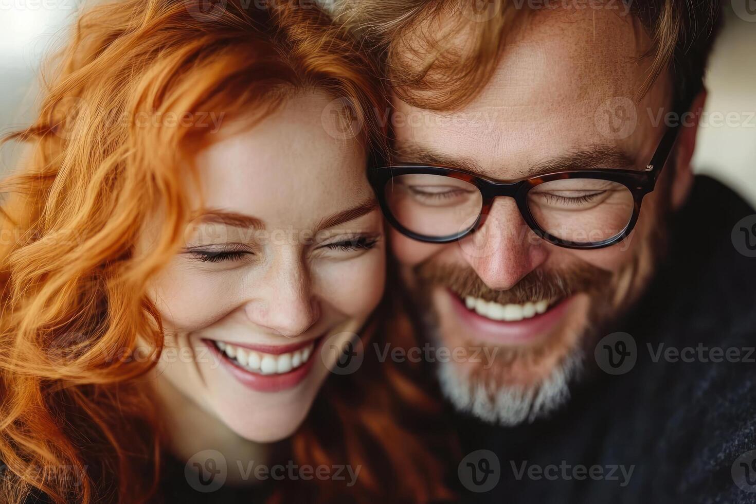 Couple sharing joyful moment with smiles in cozy indoor setting during daylight hours photo