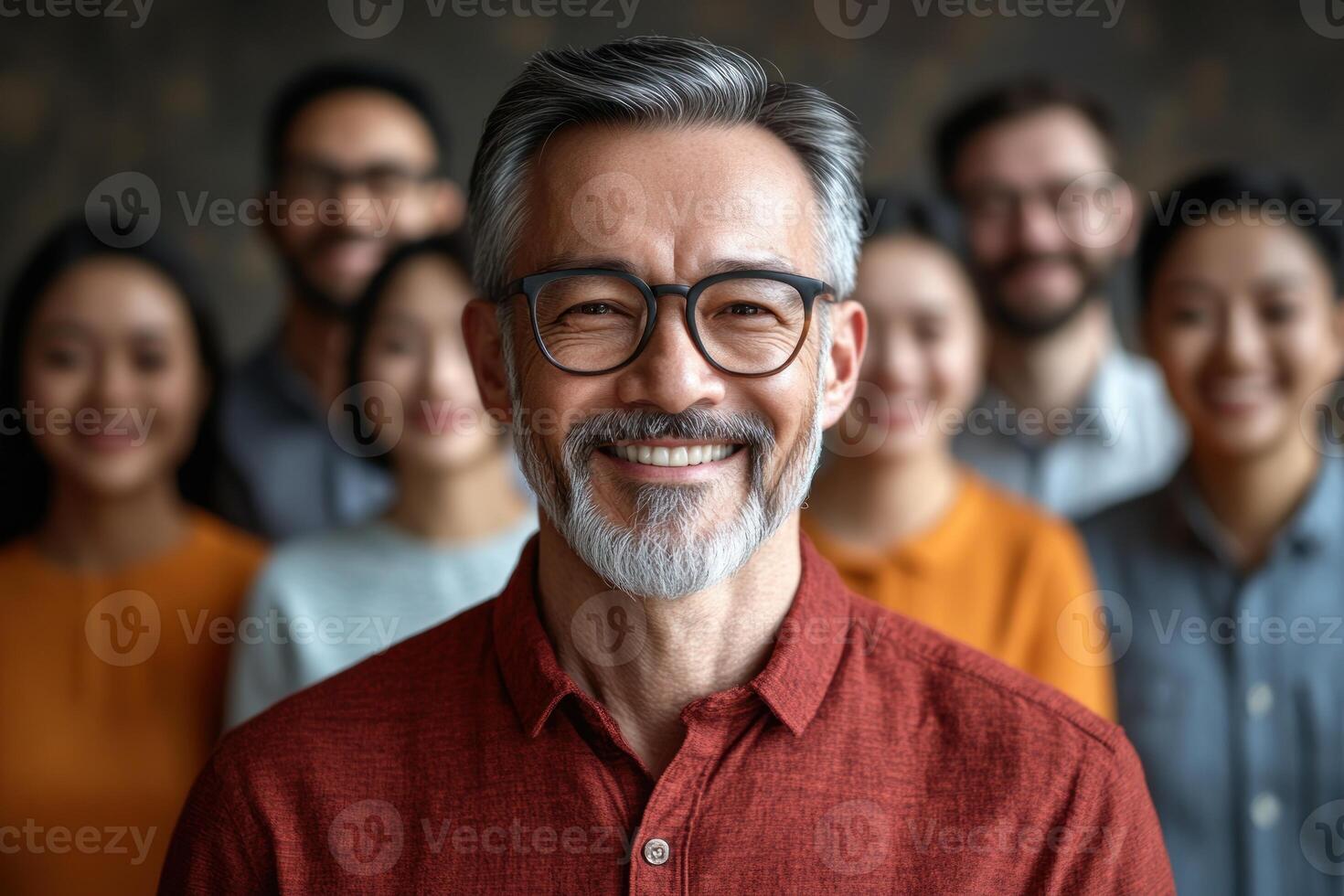Group of adults smiling together in a studio setting with warm lighting and a blurred background photo