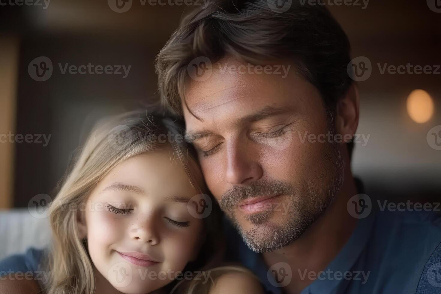 Father and daughter enjoying a peaceful moment of connection indoors with closed eyes photo