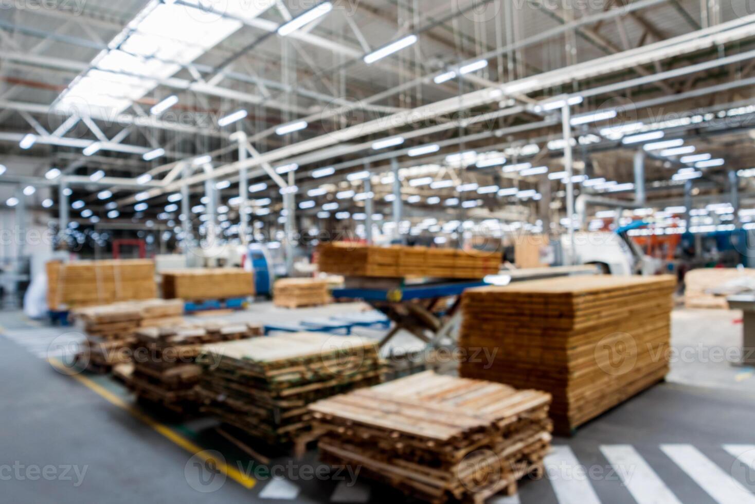 Bloored background of production line of the wooden floor factory. photo
