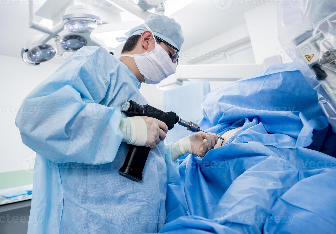 Arthroscope surgery. Orthopedic surgeons in teamwork in the operating room photo