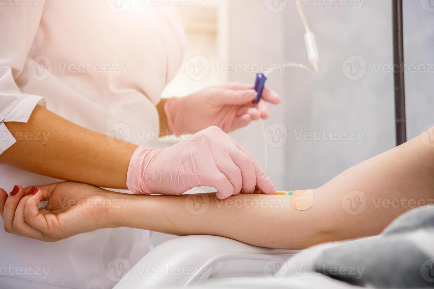 The doctor cosmetologist makes cosmetology dropper procedure. Infusion. photo