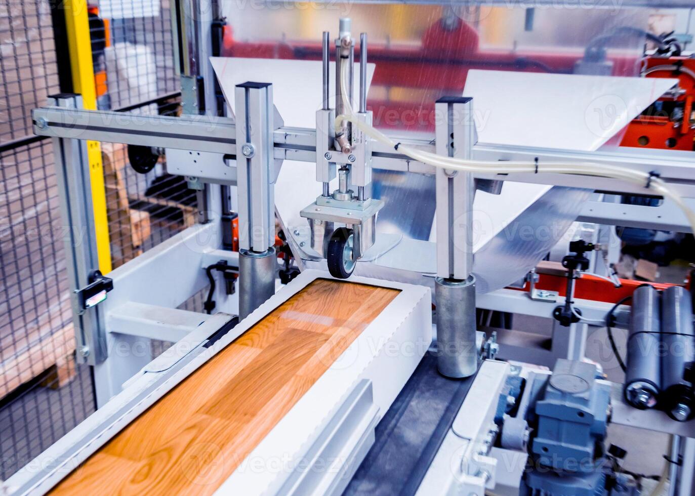 Production line of the wooden floor factory. CNC automatic woodworking machine. photo