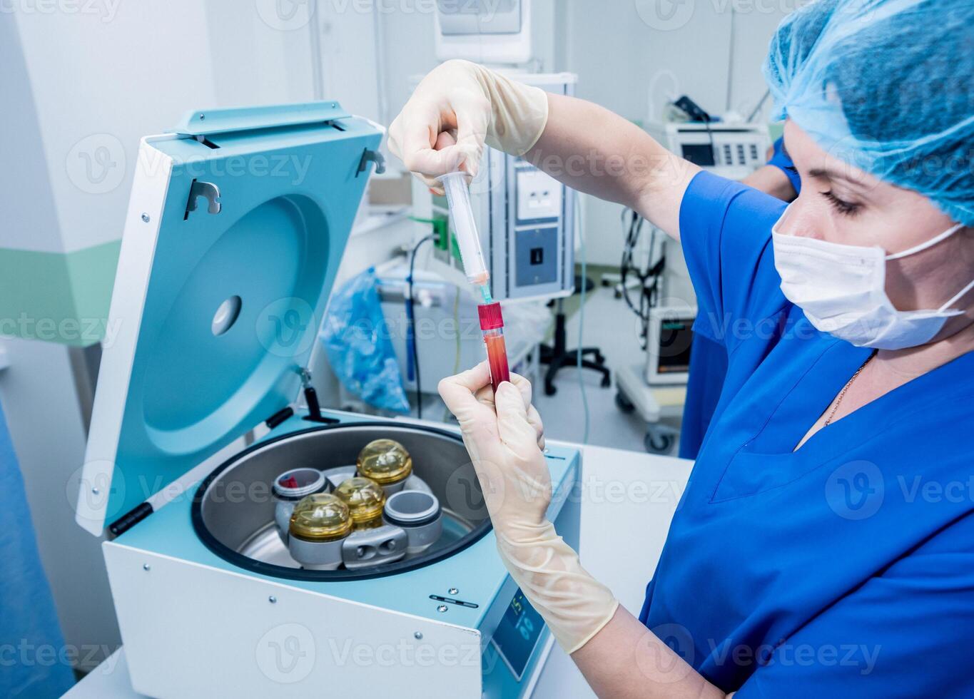 Platelet-Rich plasma preparation. Plasma in syringe. Centrifuge. photo