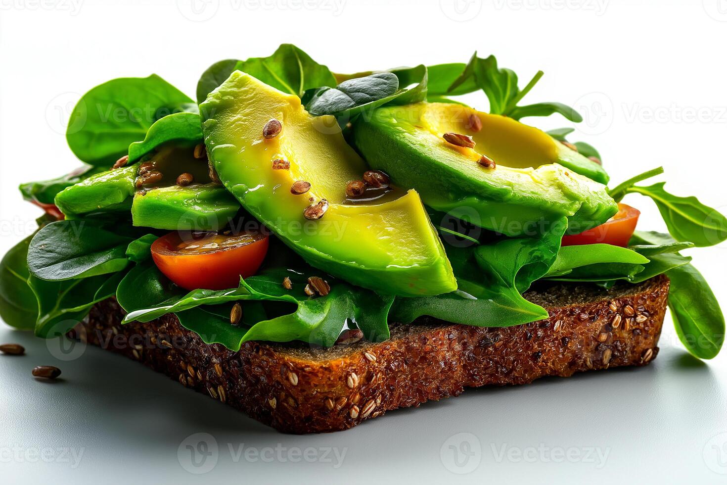 delicious whole grain bread topped with fresh avocado, spinach, and cherry tomatoes, garnished with seeds, creating healthy and vibrant meal photo