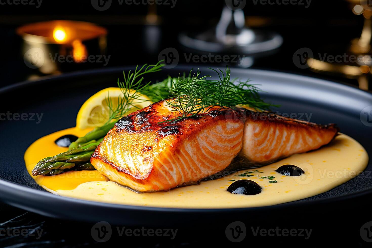 beautifully plated salmon fillet garnished with lemon and herbs, served with asparagus and creamy sauce, creating elegant dining experience photo