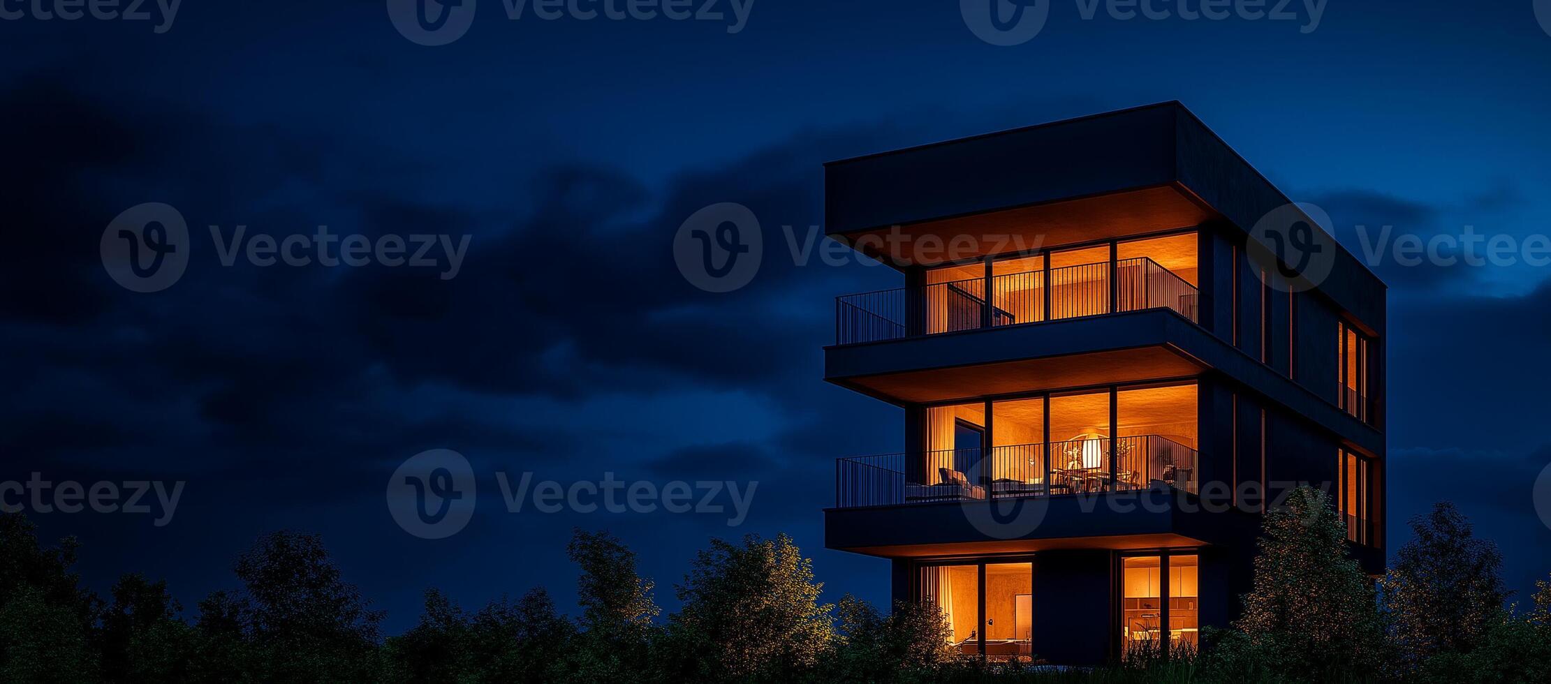 Modern three story house with illuminated interiors at night, surrounded by trees. sleek design features large windows and contemporary aesthetic, creating warm and inviting atmosphere photo