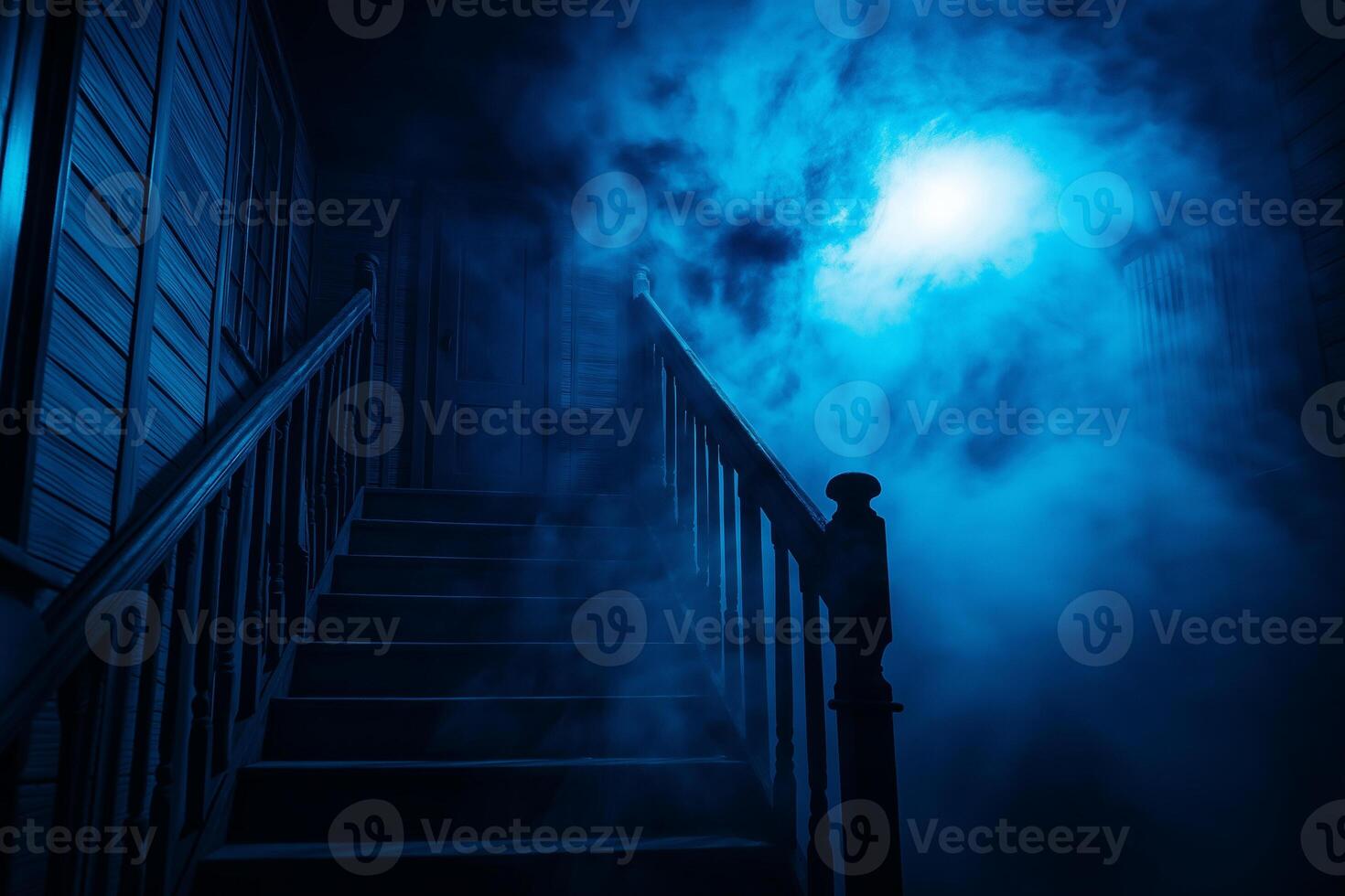 spooky haunted house with staircase shrouded in fog and illuminated by eerie blue light creates chilling atmosphere photo
