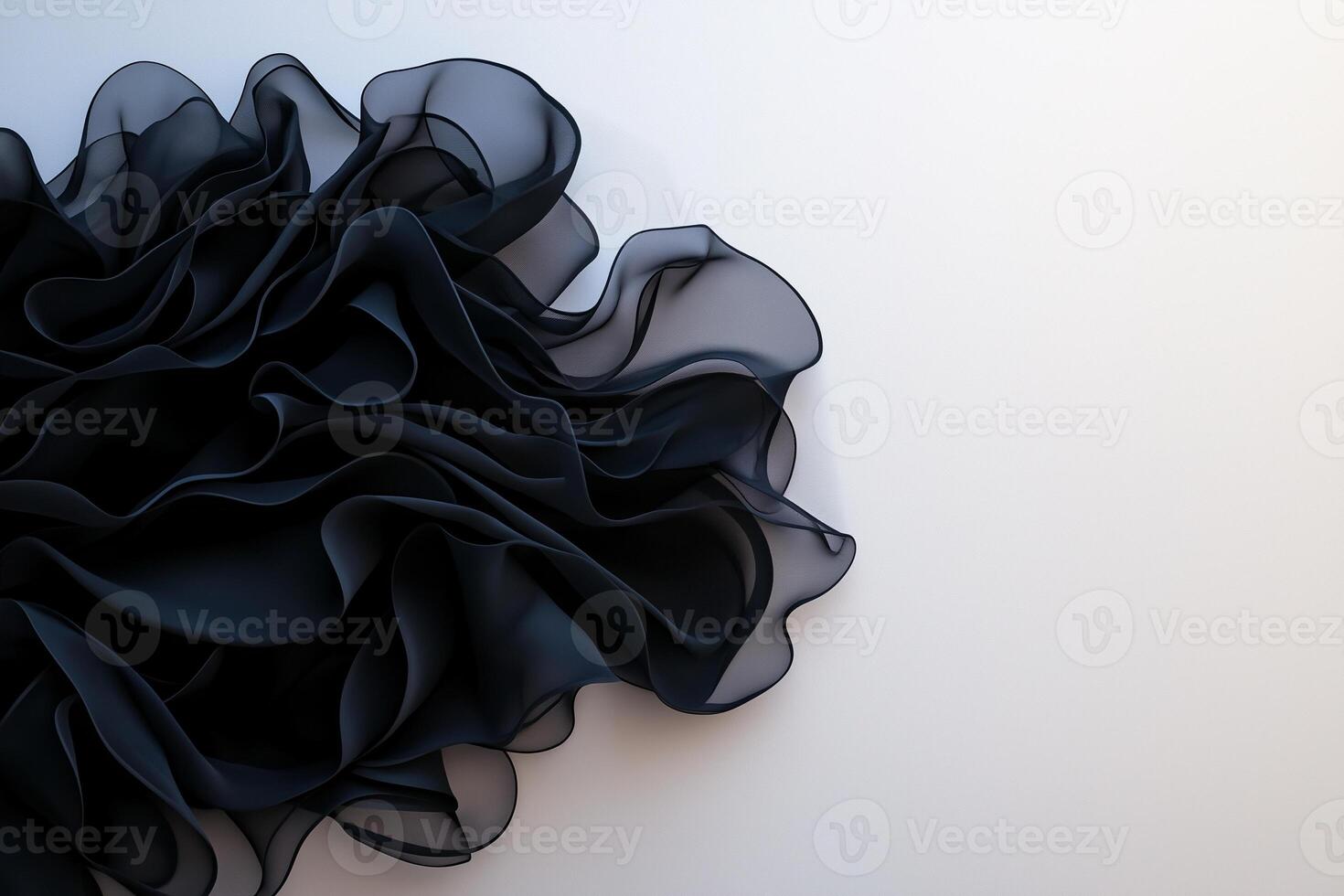 flowing black fabric with soft, ruffled textures creates elegant and dynamic visual. delicate layers evoke sense of movement and sophistication photo