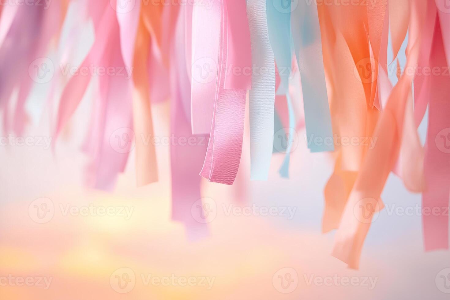 Lively streamers hang down in warm pink and orange hues as the sun sets softly in the background, creating a cheerful and inviting atmosphere perfect for celebrations photo
