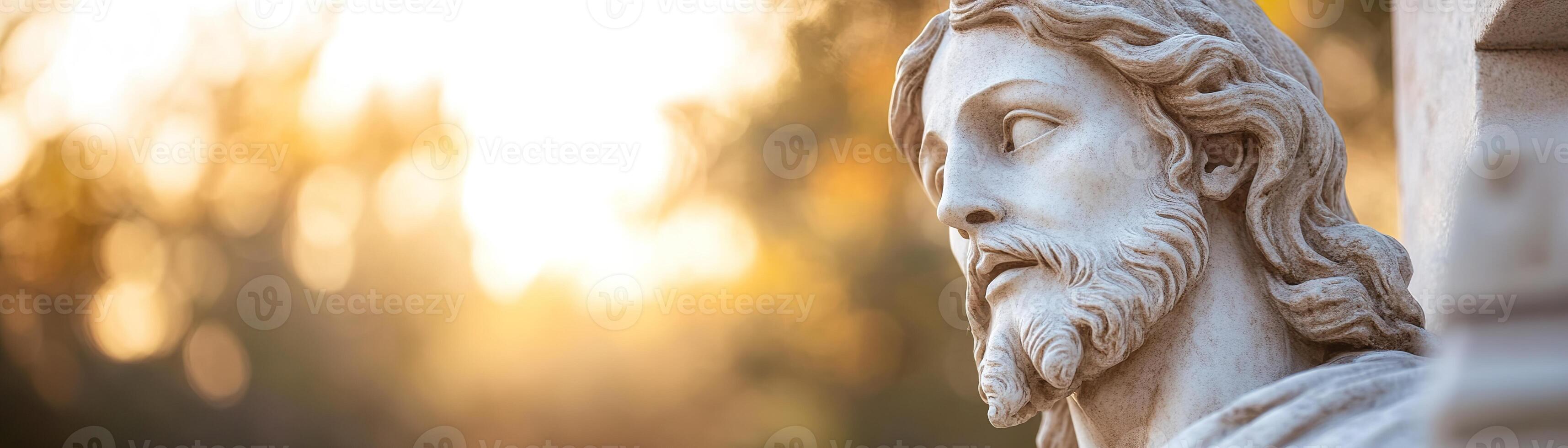 A beautifully sculpted statue of Jesus stands illuminated by soft sunlight filtering through trees. A warm, divine glow highlights his serene expression, creating a cinematic, spiritual scene photo