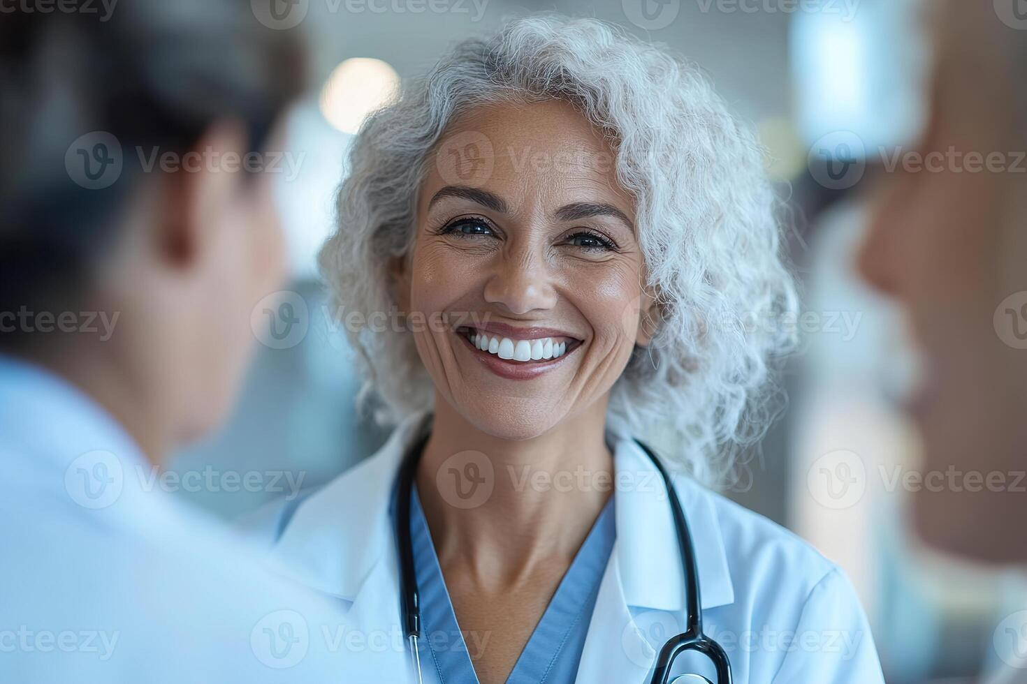 In a warm and softly lit medical office, a female gynecologist shows an ultrasound scan to a smiling pregnant patient, fostering a positive and joyful experience during prenatal care photo