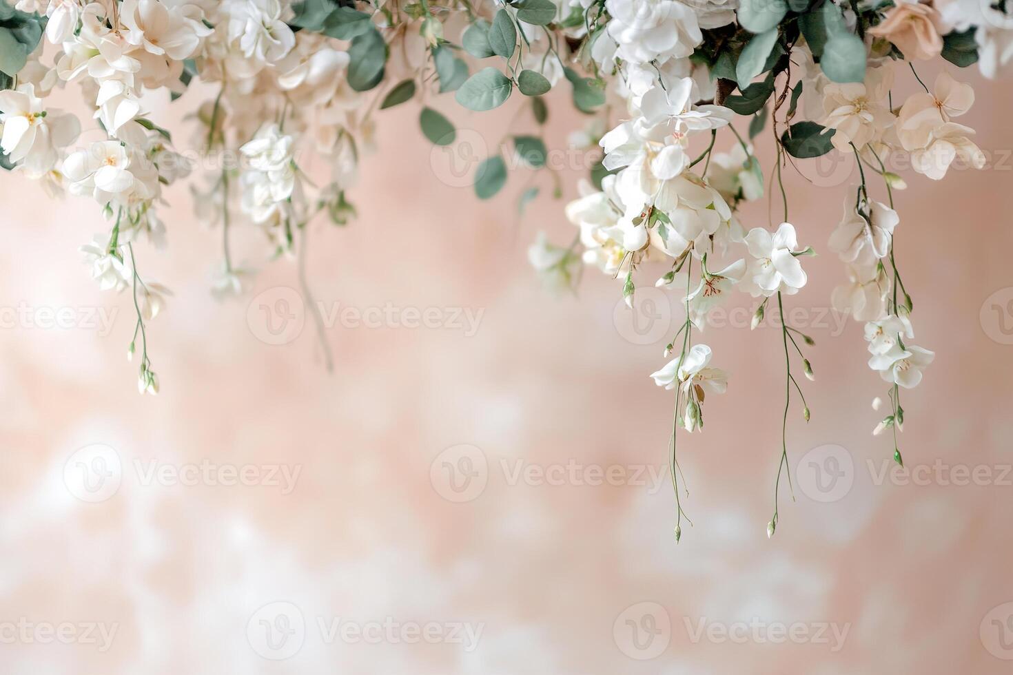 Soft floral streamers adorned with white flowers and green vines hang gracefully, creating a dreamy atmosphere. The open space below invites personalization with text or messages photo