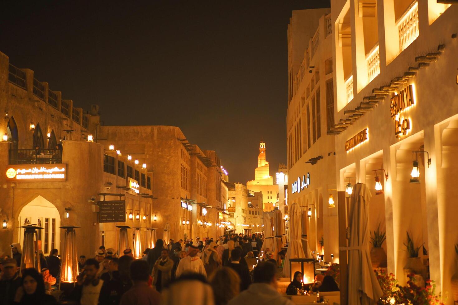 qatar doha 2 february 2025 Bustling market street in a vibrant city during evening hours photo