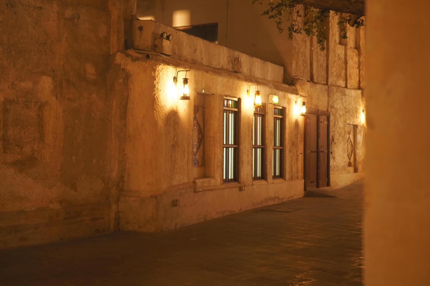 qatar doha 31 january 2025 Warm evening light illuminating historic buildings in a quiet street photo