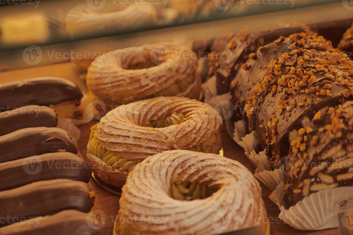 Display of various pastries at a local bakery during afternoon hours photo