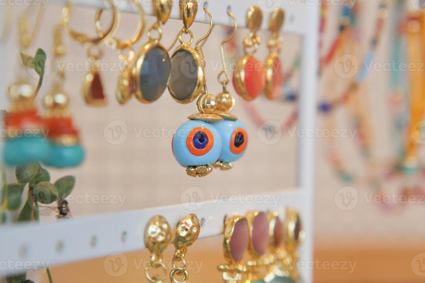 Unique handmade earrings displayed at a local craft fair photo