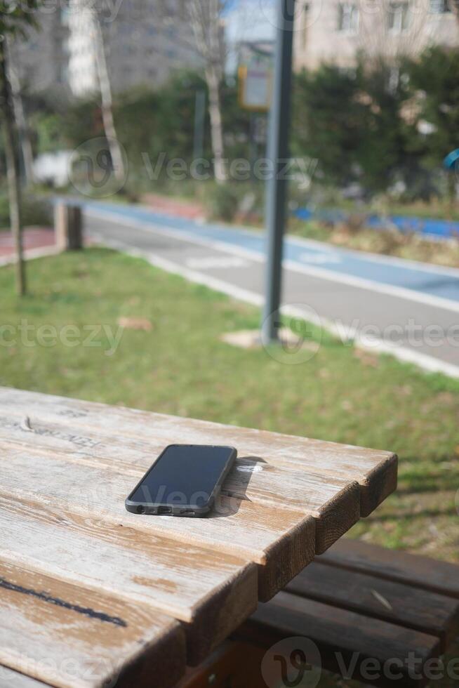 lost phone on a park bench photo