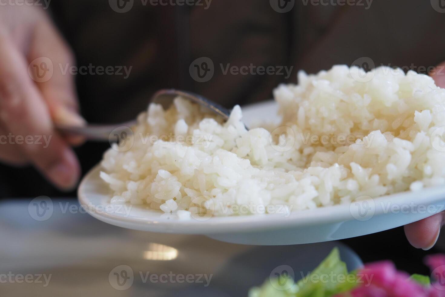 Delicious plate of freshly served rice in a cozy dining setting photo