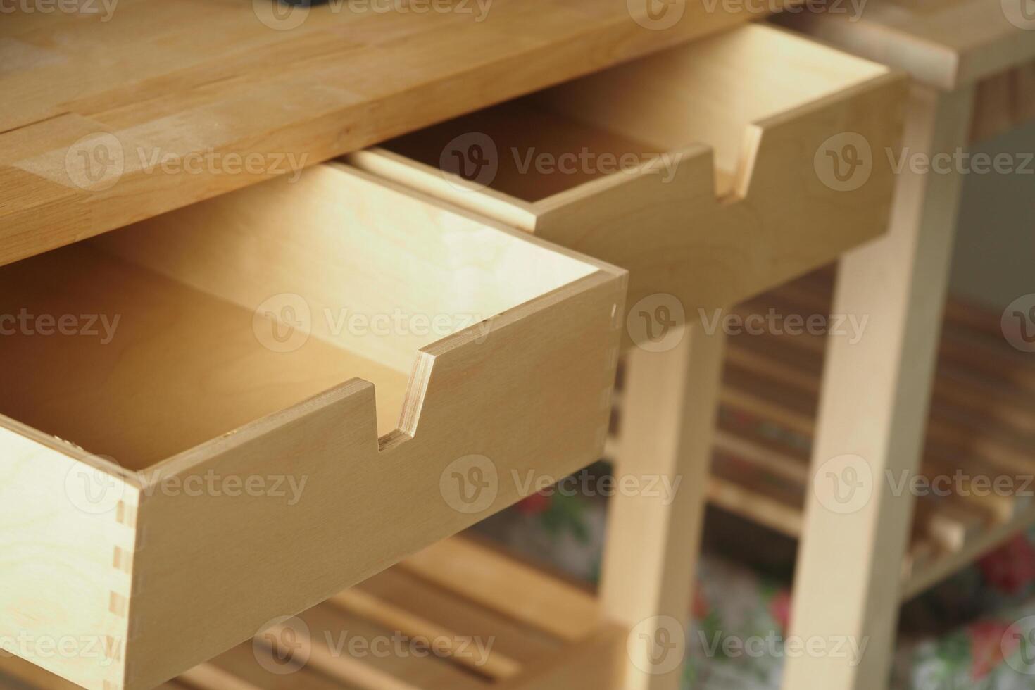 Woodworking workspace with open drawers showcasing craftsmanship photo
