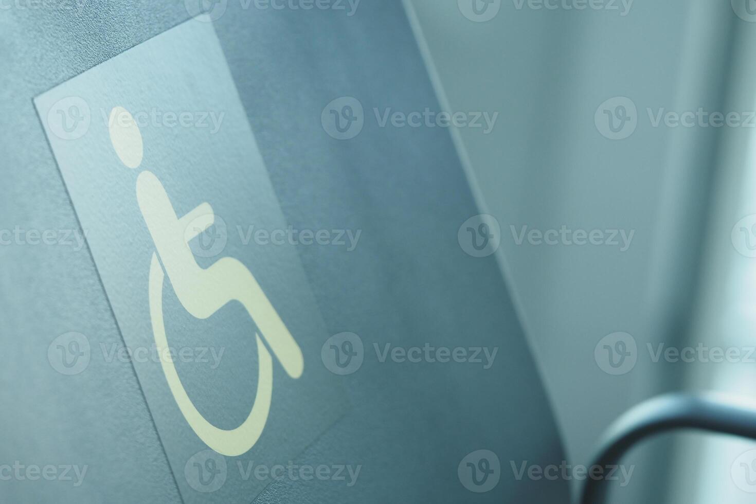 A sign indicating accessible seating for passengers with disabilities photo