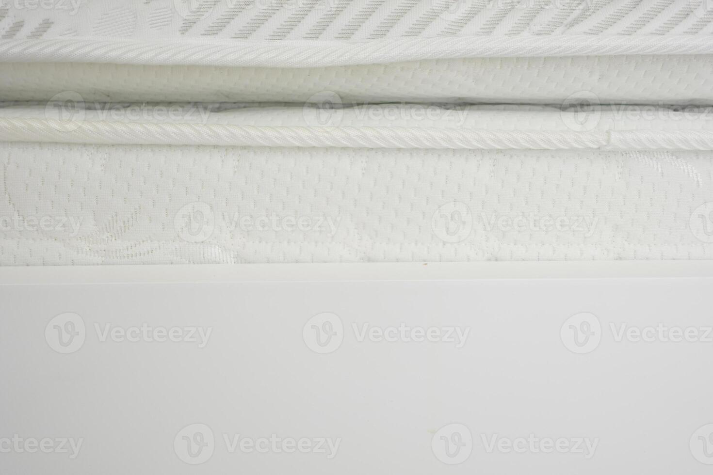 Mattress with intricate design details in bright indoor setting photo