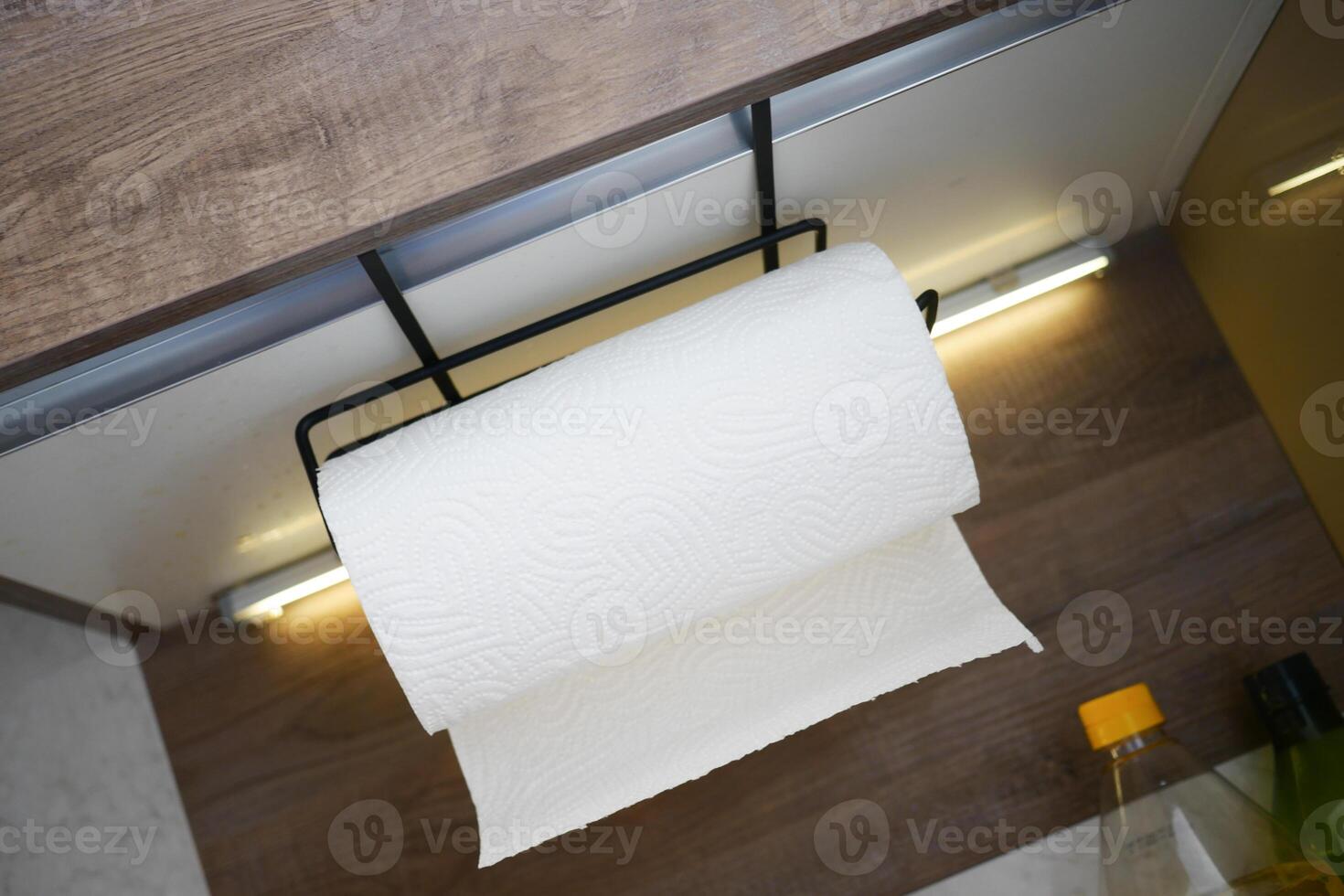 Practical kitchen setup with a paper towel holder in view photo