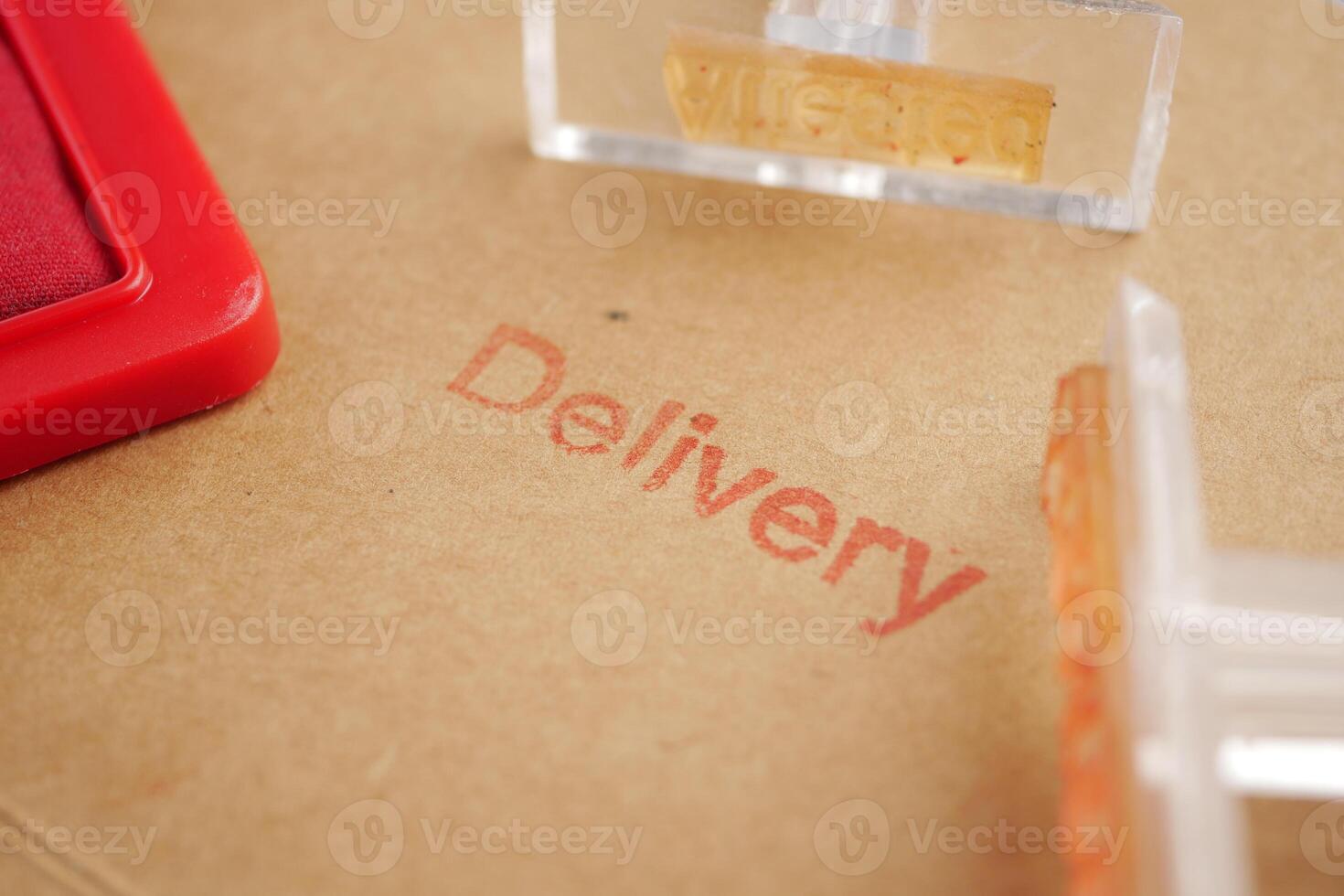 Stamps and ink for delivery marking on cardboard package photo