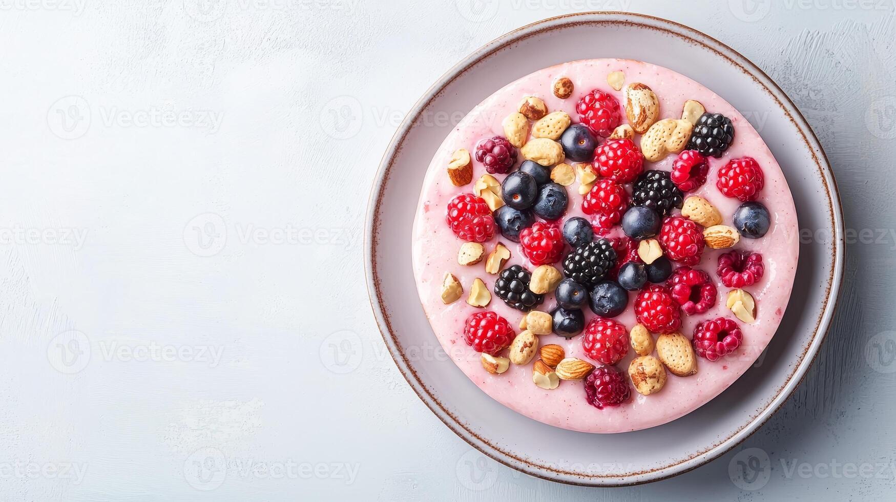 Plant-based ethics concept. A vibrant dessert topped with assorted berries and nuts, served on a light plate, showcasing a delicious blend of colors and textures. photo