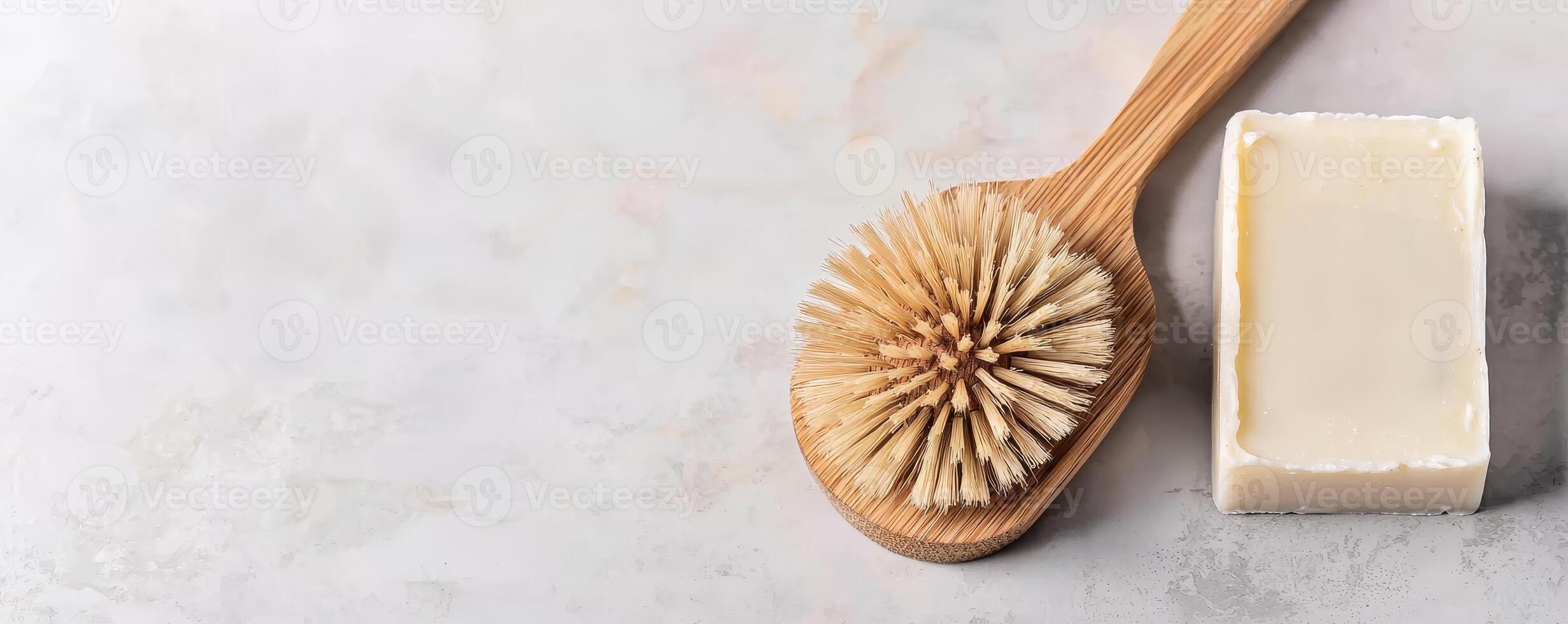 Zero waste lifestyle with DIY concept. wooden brush and a bar of soap on a textured surface. photo