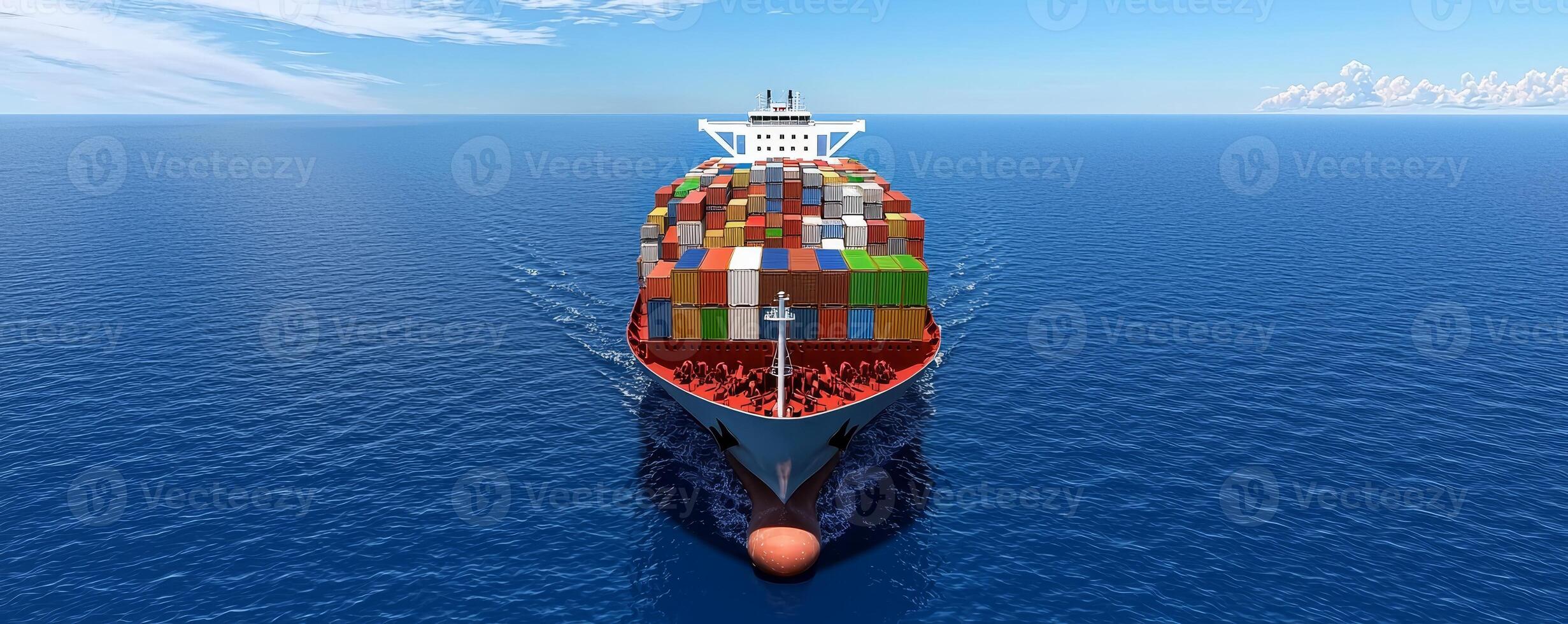 A large cargo ship filled with colorful containers sails across a calm blue ocean under a clear sky. photo
