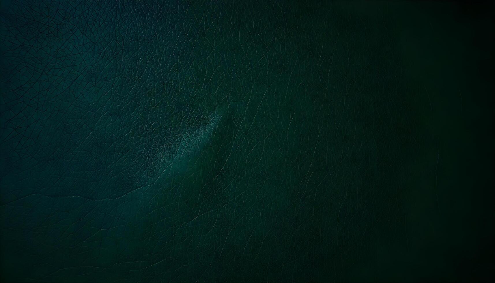 Aged dark green leather texture with deep creases and a matte finish in a dimly lit setting photo