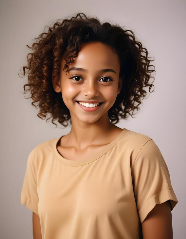 Charming Ethiopian girl with curly hair and a vibrant smile on a plain backdrop photo