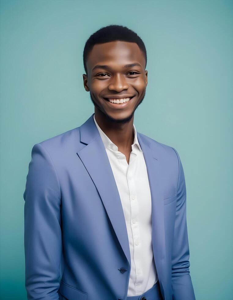 Joyful Nigerian man with a radiant smile, dressed in stylish fashion, standing against a clean background photo
