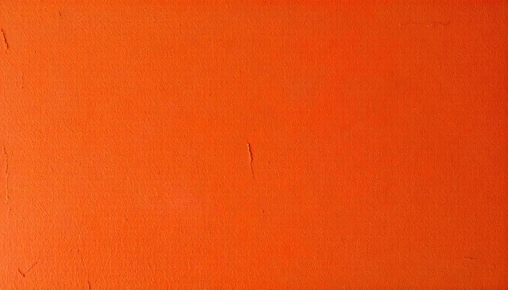 Vibrant terracotta texture background, incorporating a blend of orange, red, and brown tones, with visible brush strokes suggesting a handmade quality, under soft artificial lighting photo
