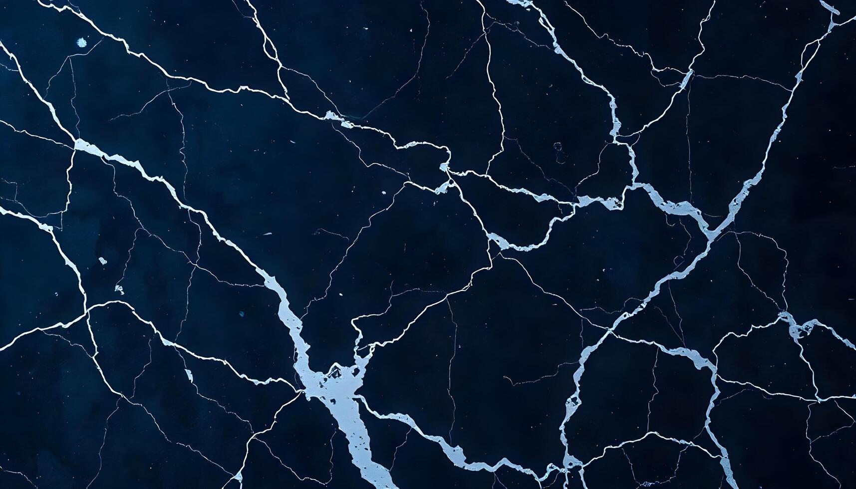 Dark blue marble texture with white veins and cracks photo