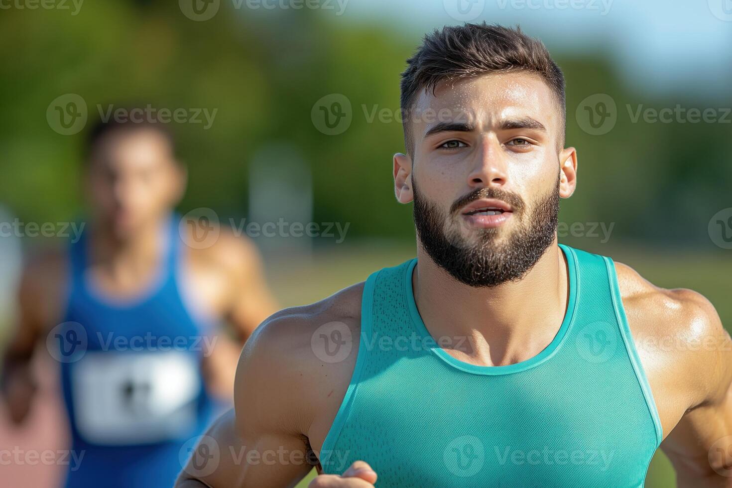 Portrait of male athlete male athlete runs at a stadium during a competition photo