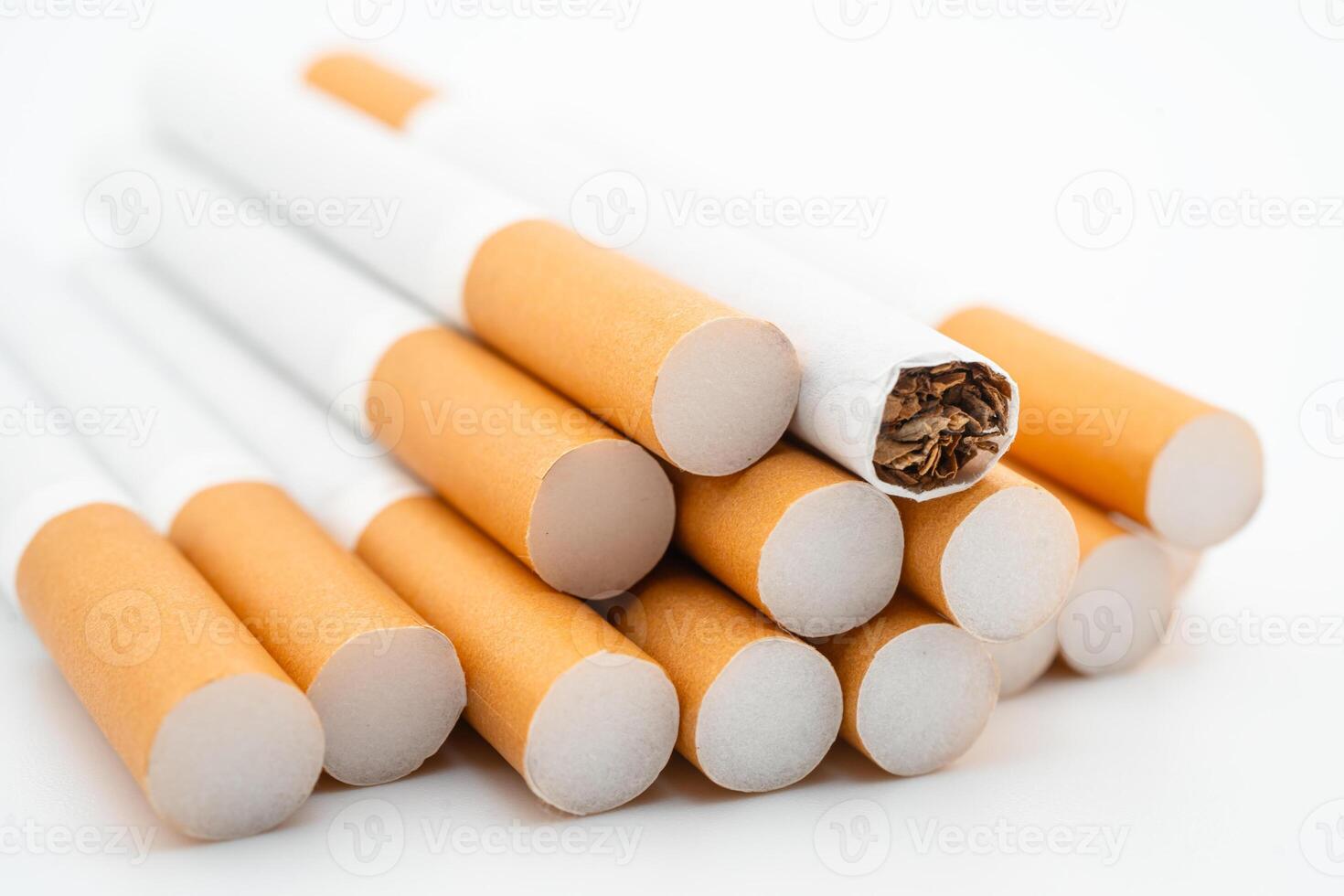 Cigarette, roll tobacco on white photo