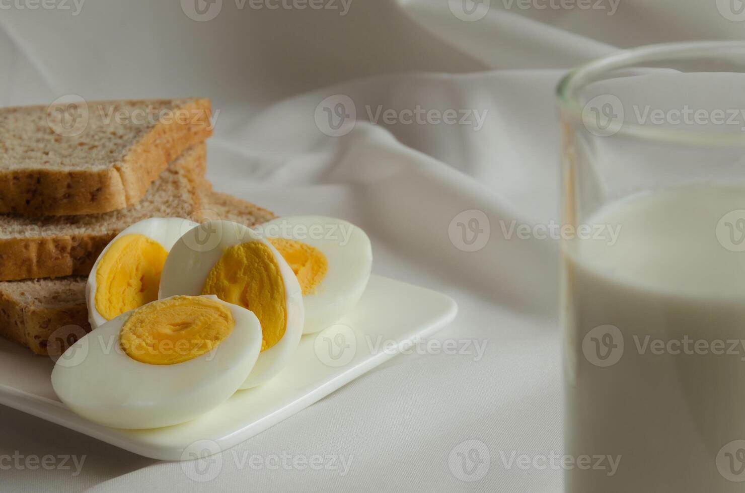 Sliced Whole Wheat Bread, Boiled Egg and Milk for Healthy Breakfast photo
